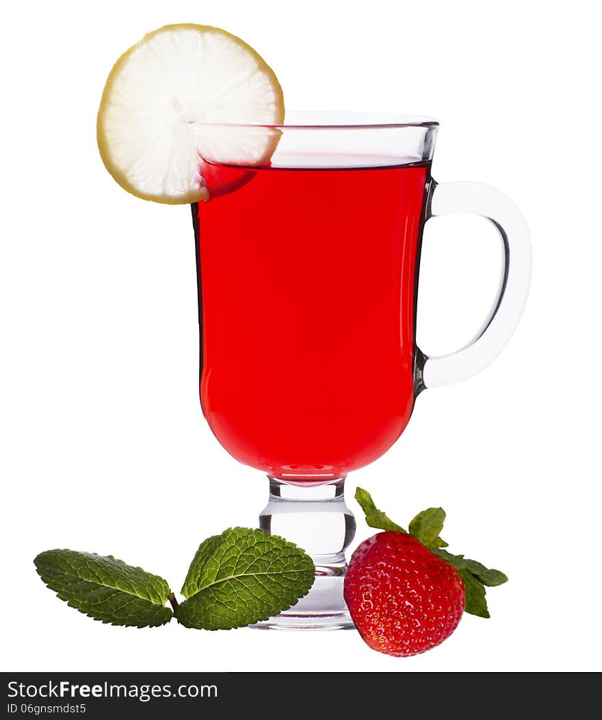 Cup of strawberry tea with mint and a lemon on a white background