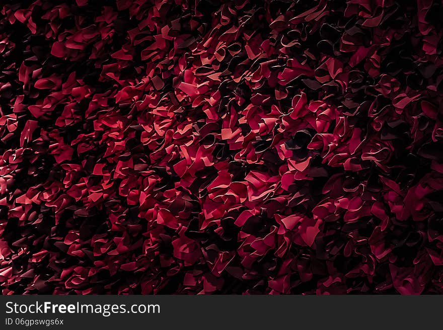 Red and black paper flowers adorn a wall in a building for Valentine's Day. Red and black paper flowers adorn a wall in a building for Valentine's Day