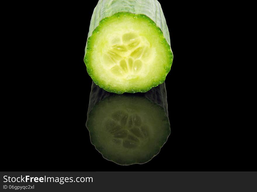 Cucumber cross section isolated on black background