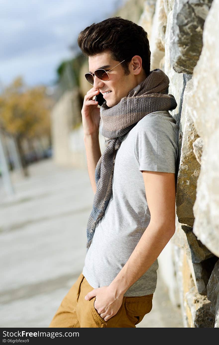 Handsome Man In Urban Background Talking On Phone