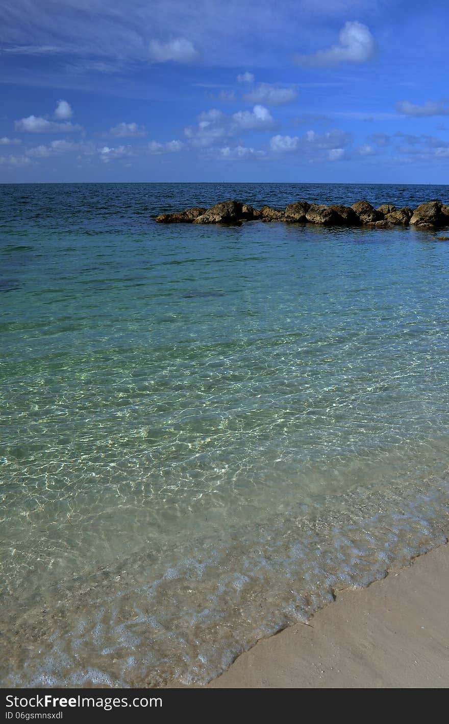 Shallow tropical water and sandy beach in Key West, FL