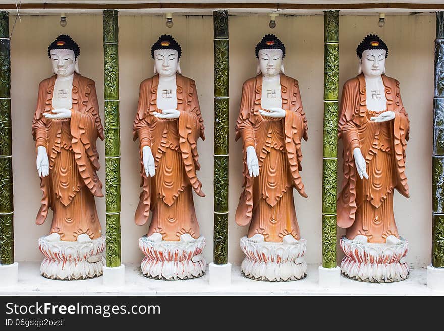 Four buddha statues at Penang's temple in Malaysia.