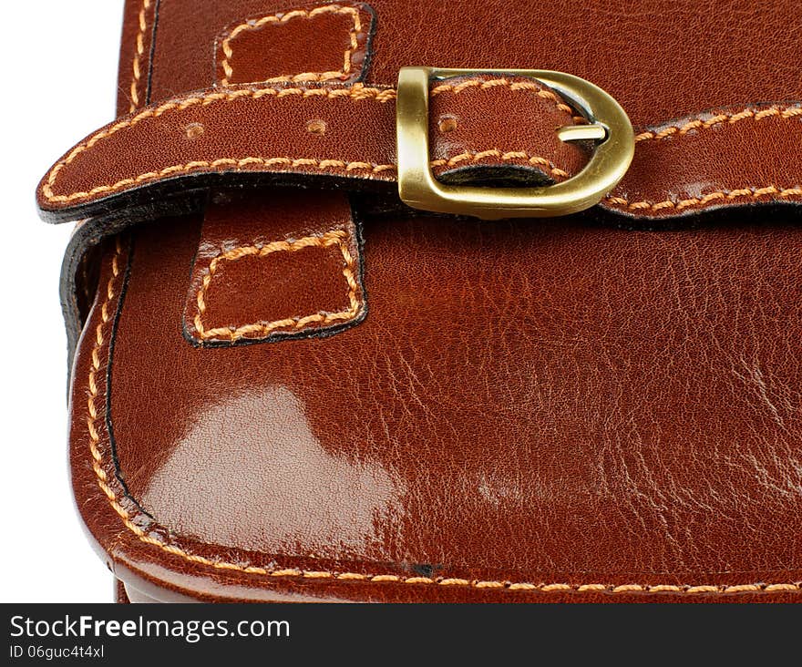 Details of Ginger Leather Traveling Bag with Pocket Bronze Rivet and Backstitch closeup on white background. Details of Ginger Leather Traveling Bag with Pocket Bronze Rivet and Backstitch closeup on white background