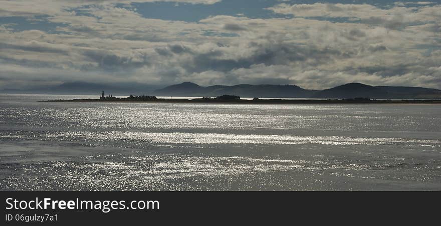 Chanonry lighthouse sunset view from Fort George. Chanonry lighthouse sunset view from Fort George