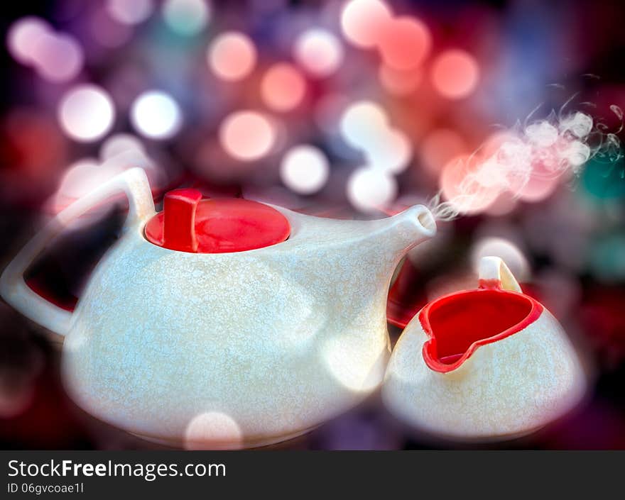 Hot red and white bone china tea or coffee kettle with bokeh background