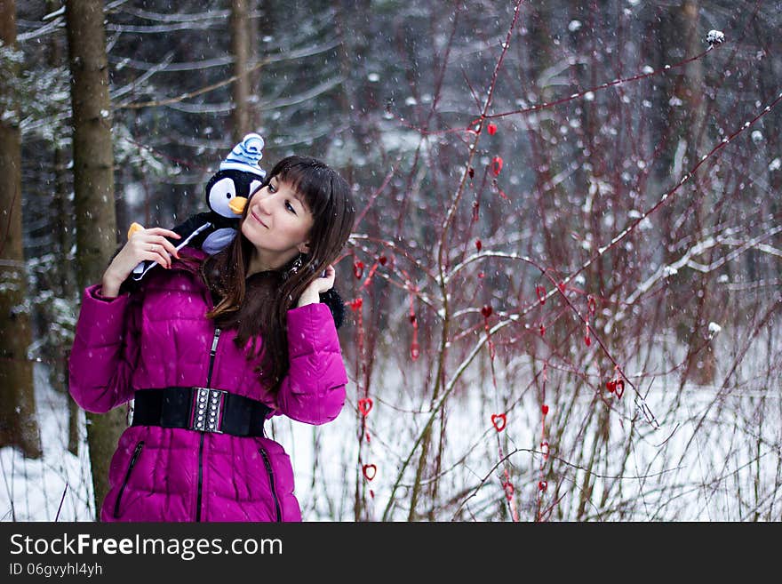 Portrait of beautiful woman in snow winter forest