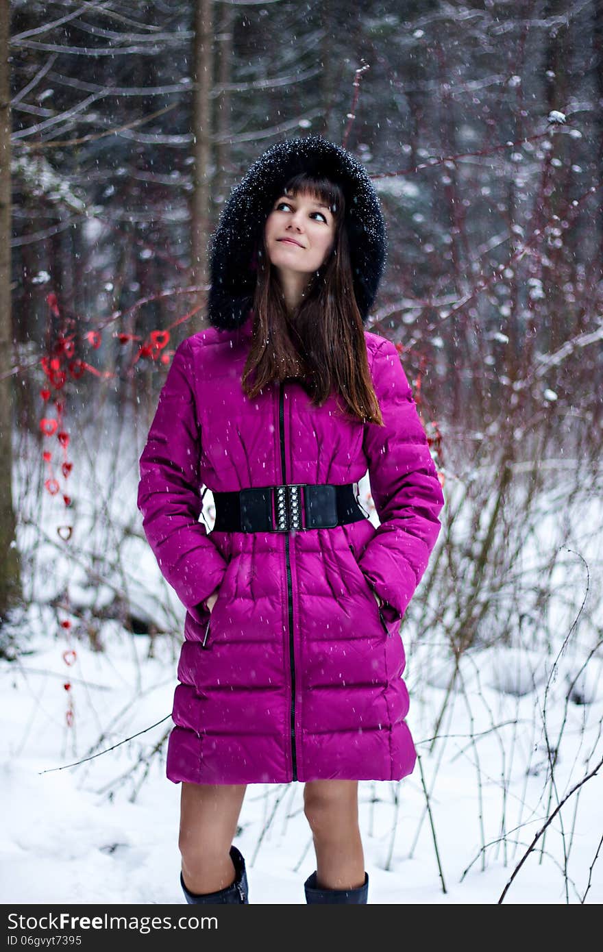 Portrait of beautiful woman in snow winter forest