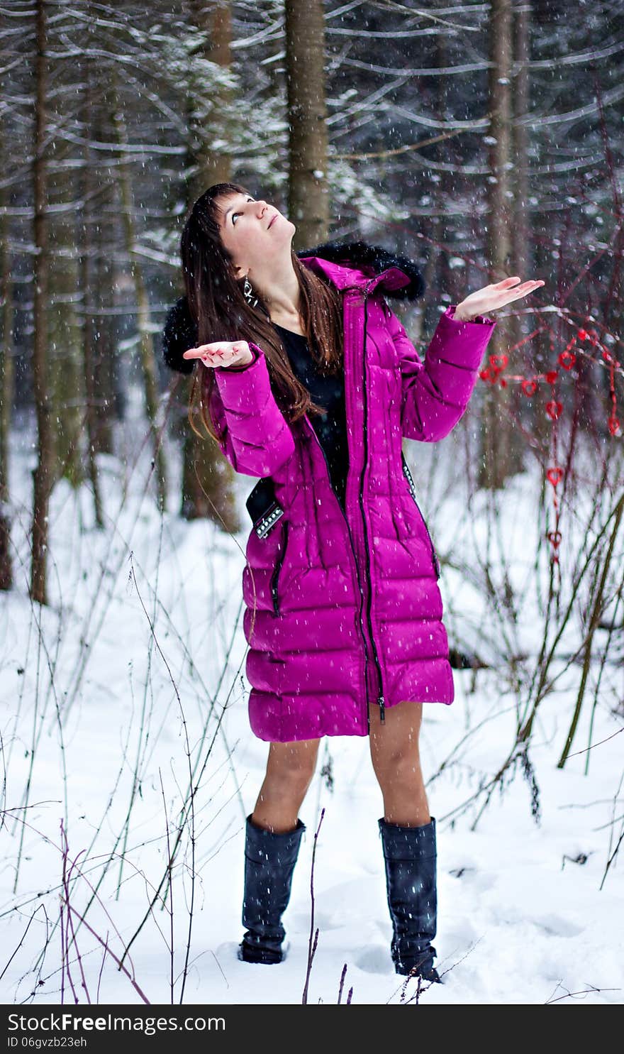 Portrait of beautiful woman in snow winter forest