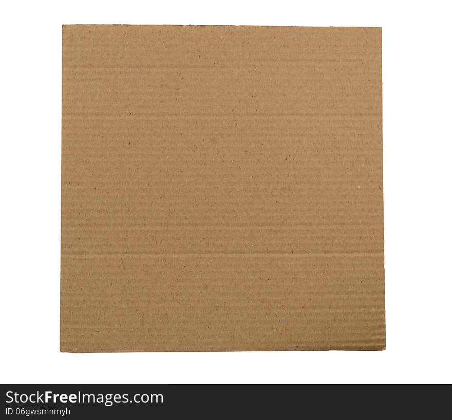 Brown corrugated cardboard isolated on a white background with lots of copy space. Brown corrugated cardboard isolated on a white background with lots of copy space.