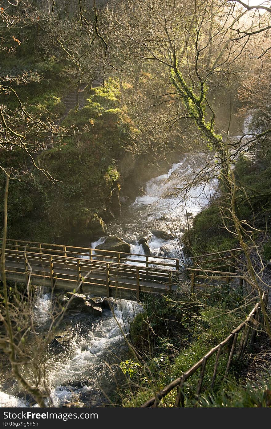 Bridge over the river in winter, Lyn valley, Devon, England. Bridge over the river in winter, Lyn valley, Devon, England.