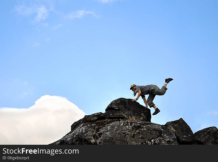 A man show dance move on the mountain. A man show dance move on the mountain.