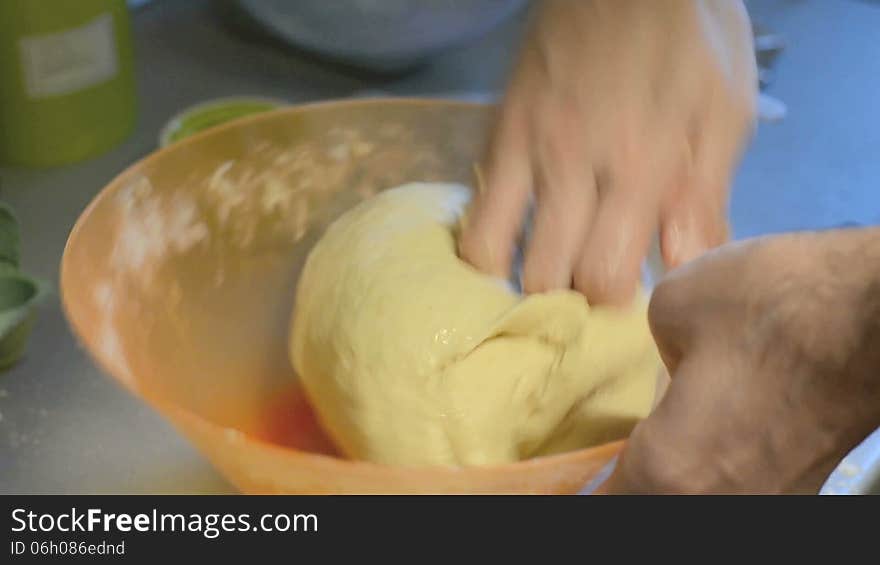 Kneading sweet cinnamon bread close-up