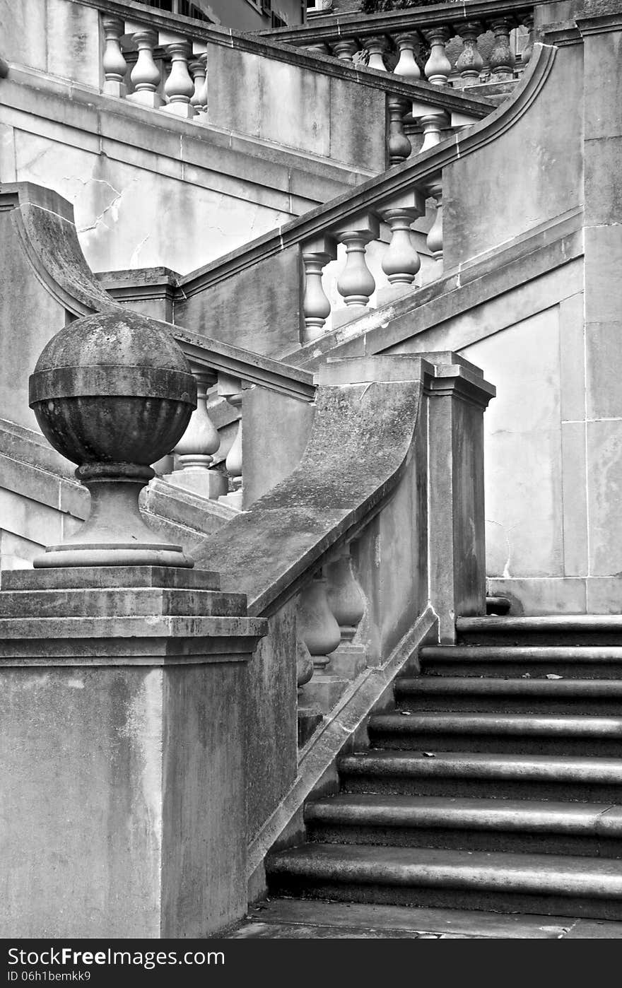 Black and white steps leading to the garden above.