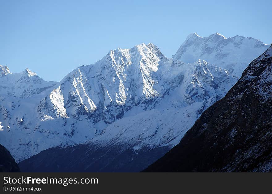 High mountains with steep slopes and snow peaks, Nepal, trek around the Manaslu. High mountains with steep slopes and snow peaks, Nepal, trek around the Manaslu