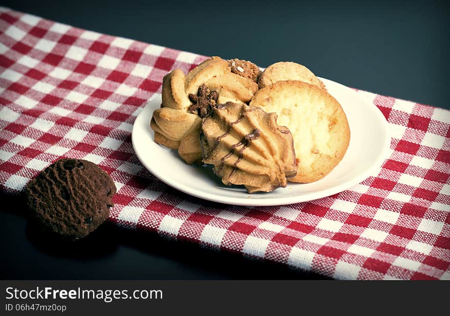 Mixed cookies on a white plate. Mixed cookies on a white plate