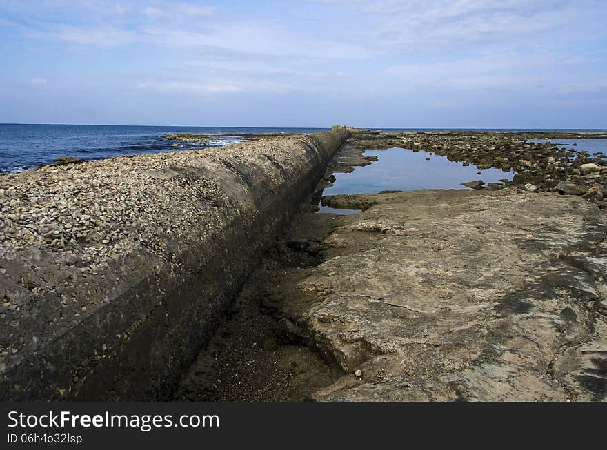 Sewage pipe having their outlet right into the sea pollution the water.