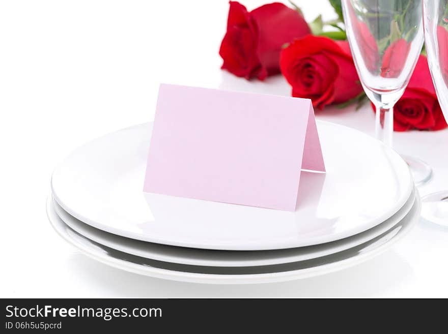 Card for congratulation on a plate, roses and glasses