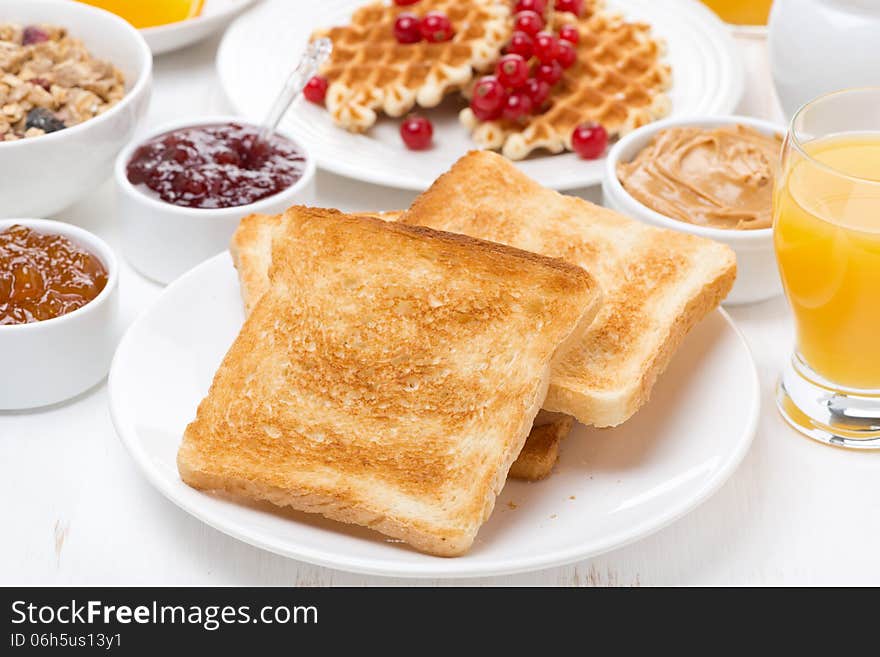 Continental breakfast - toast, jam, peanut butter, juice, horizontal