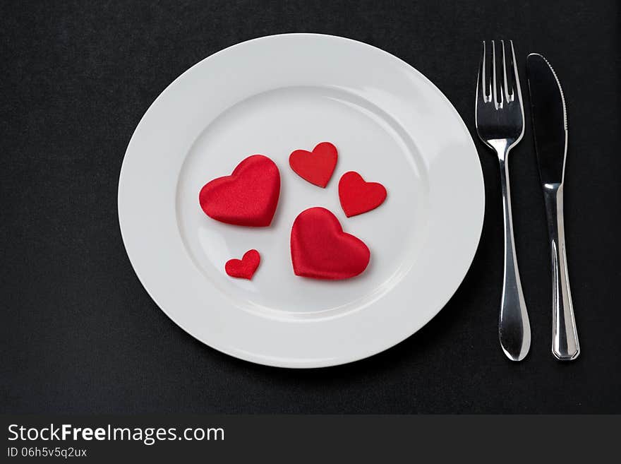 Festive table setting with red hearts, horizontal