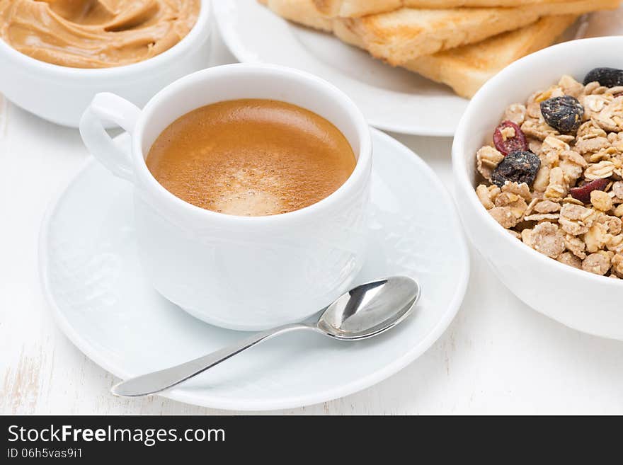 Freshly brewed espresso and muesli for breakfast