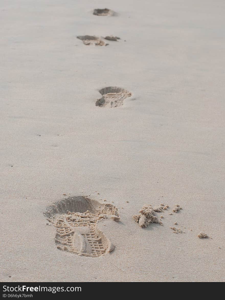 Foot prints on a sandy beach