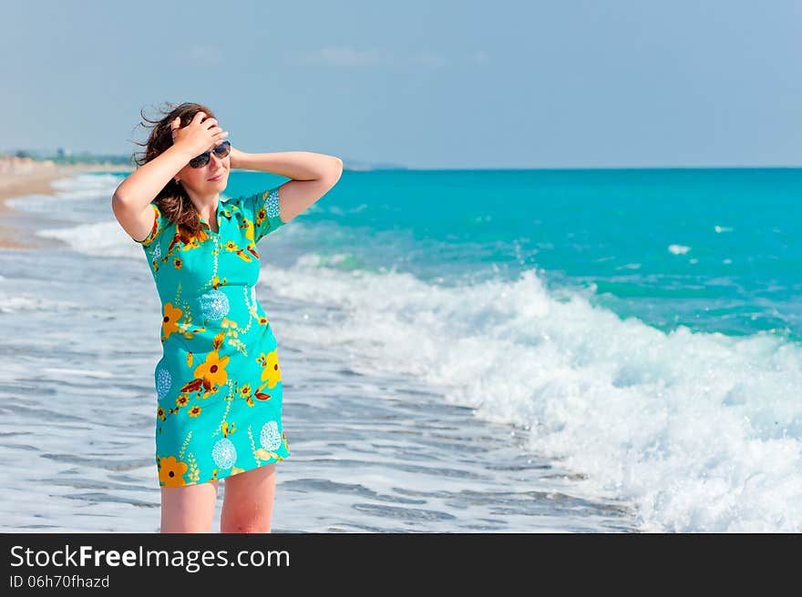 Girl On The Beach In Sunglasses