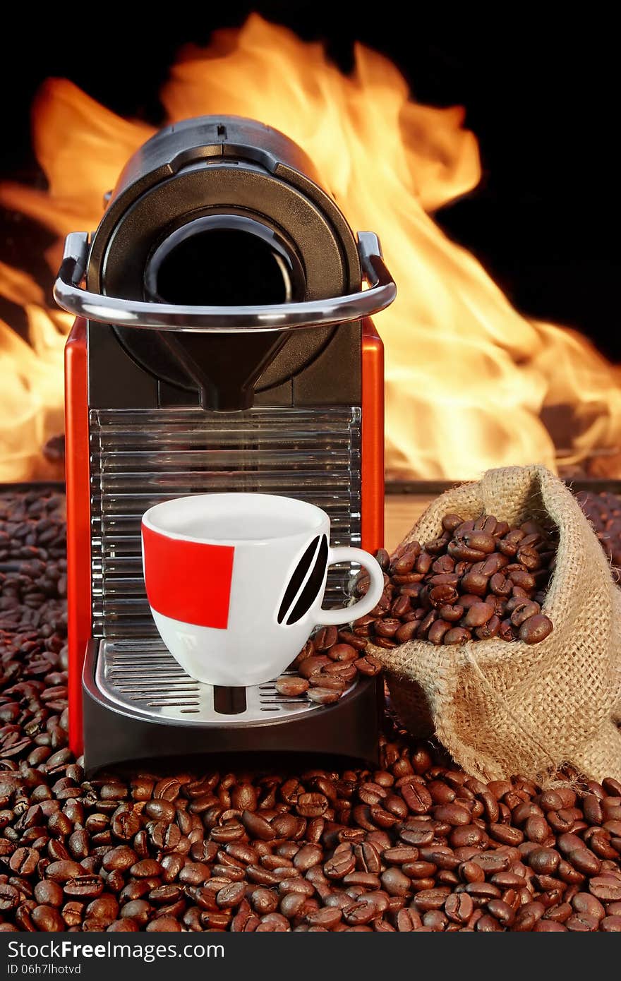 Coffee machine with cup  of espresso near fireplace