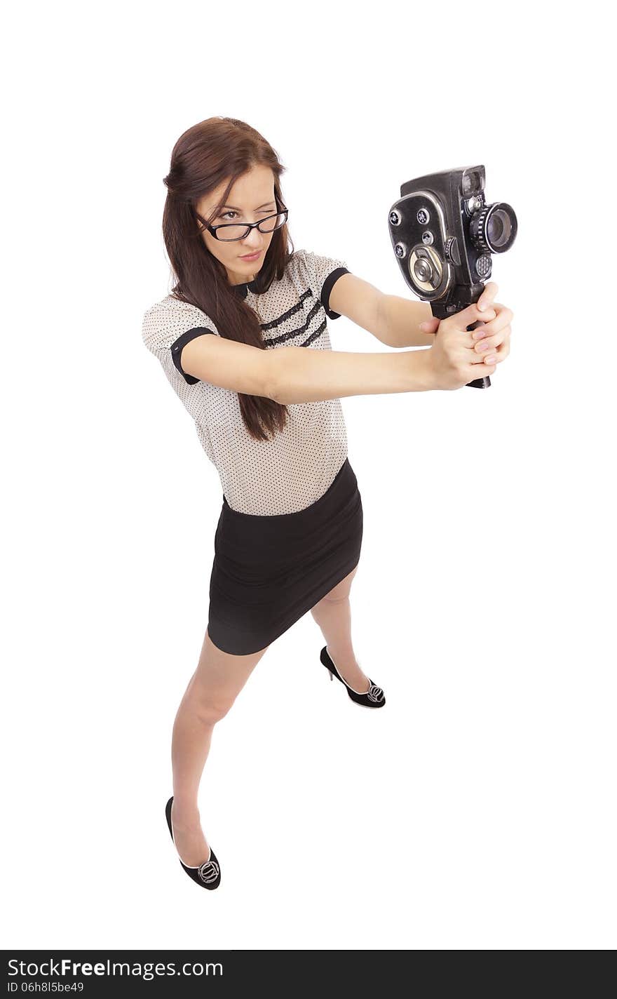 Girl with old movie camera on white background