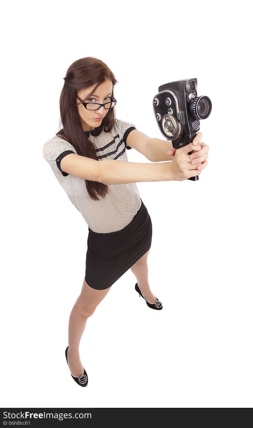 Girl with old movie camera on white background