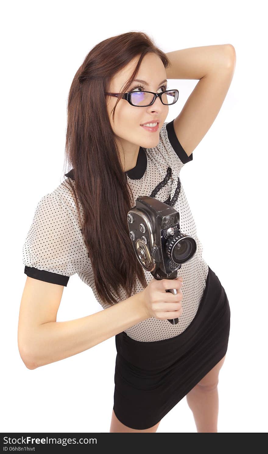 Girl with old movie camera on white background