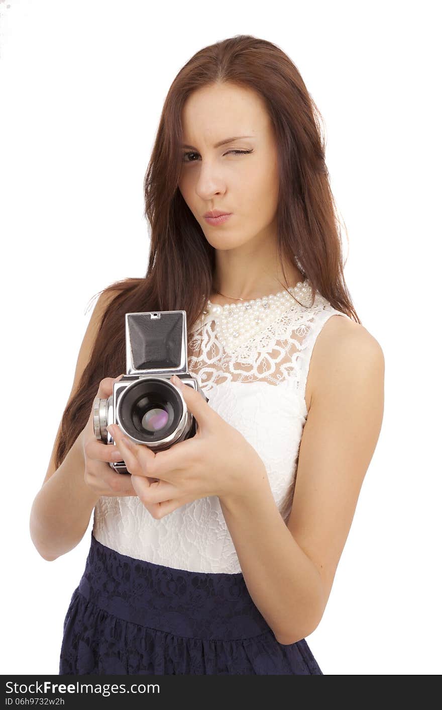 Girl with an old camera on a white background