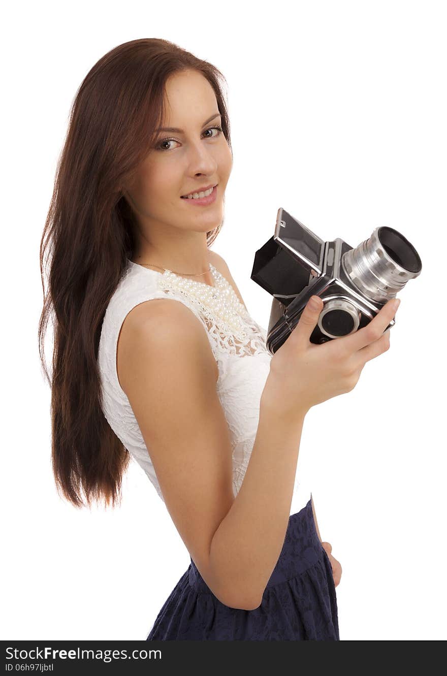 Girl with an old camera on a white background