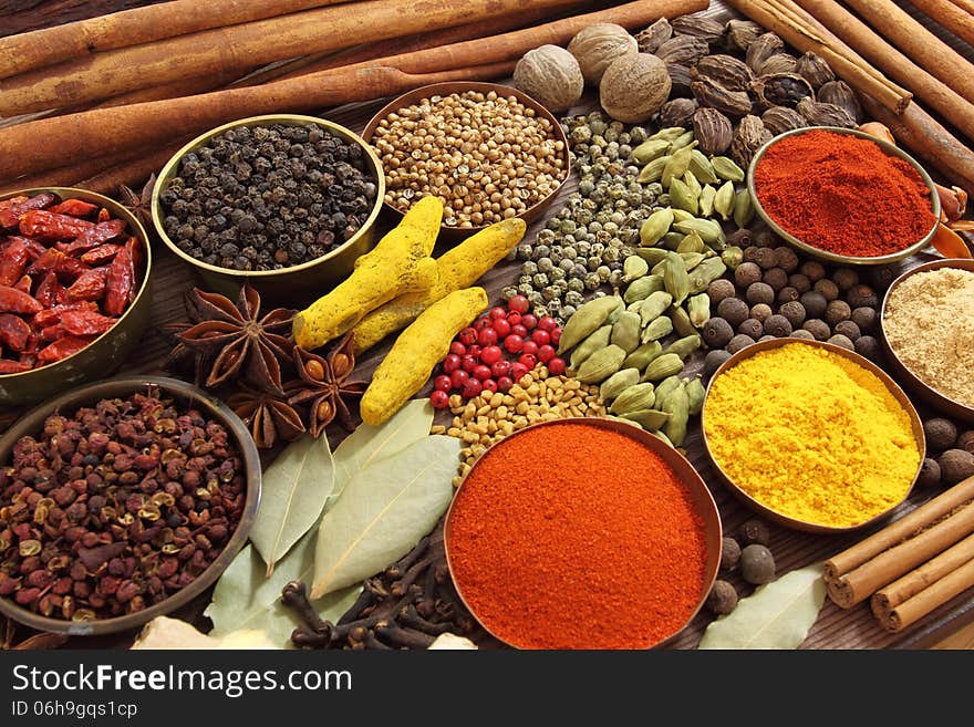 Spices and herbs in metal bowls. Food and cuisine ingredients. Spices and herbs in metal bowls. Food and cuisine ingredients.