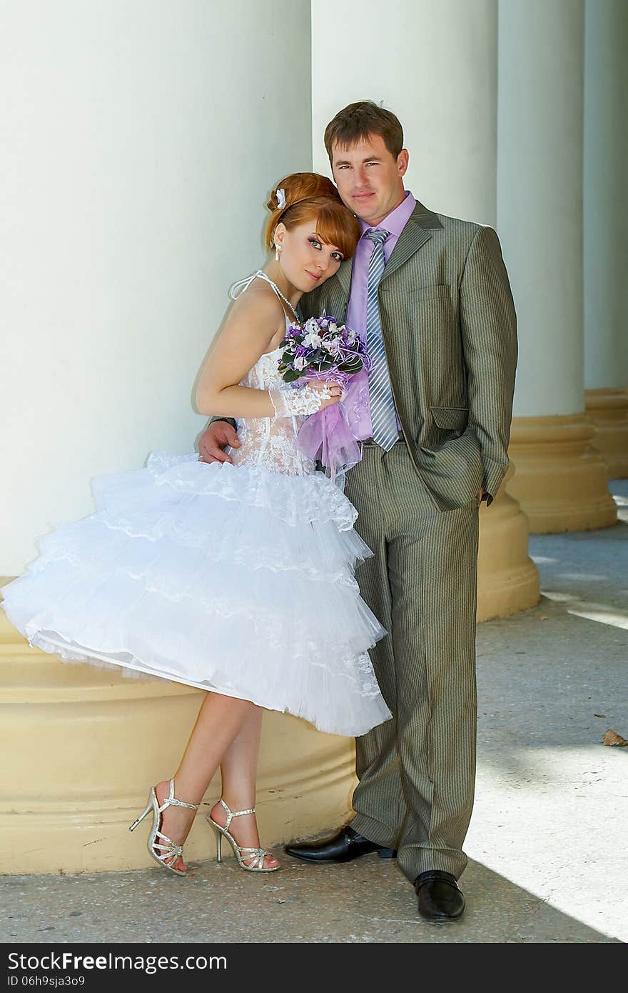 Beautiful charming bride short dress and happy groom. Beautiful charming bride short dress and happy groom