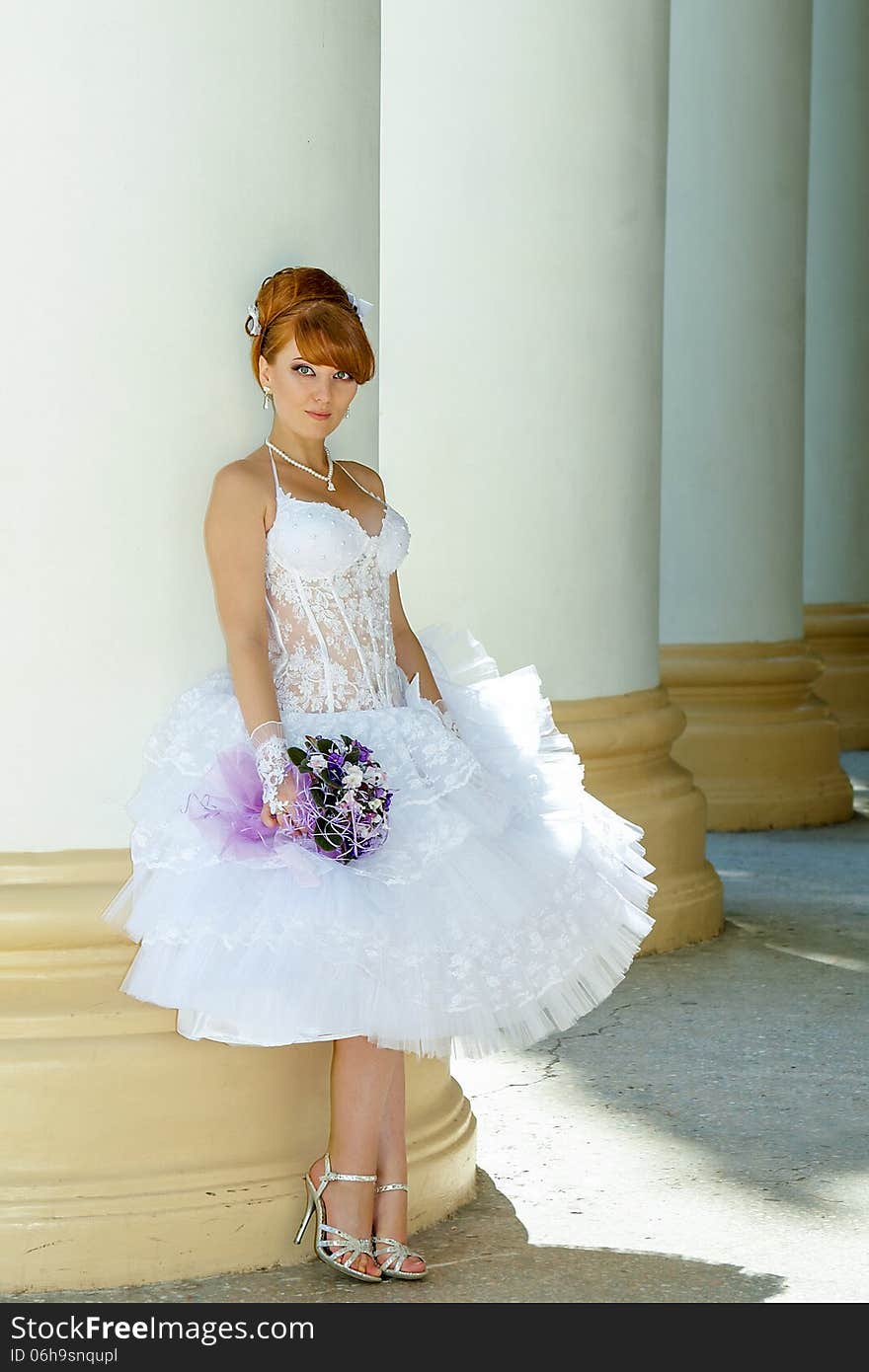 Beautiful redhead bride with big eyes on a sunny day. Beautiful redhead bride with big eyes on a sunny day