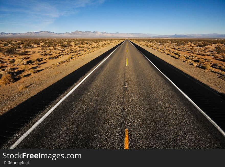 Road leads into mountains far away