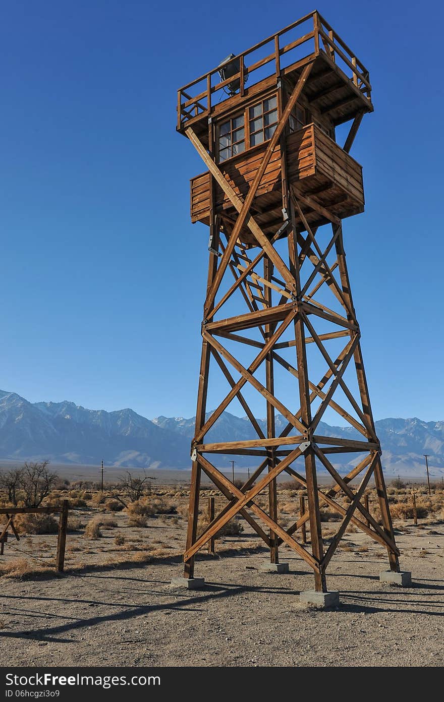 Wooden guard tower in desert by mountains