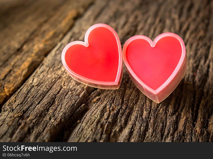 Red heart on old wood.