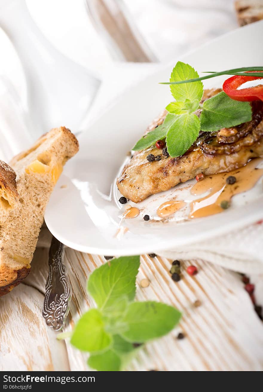 Delicious nourishing steak with vegetables, greens and bread