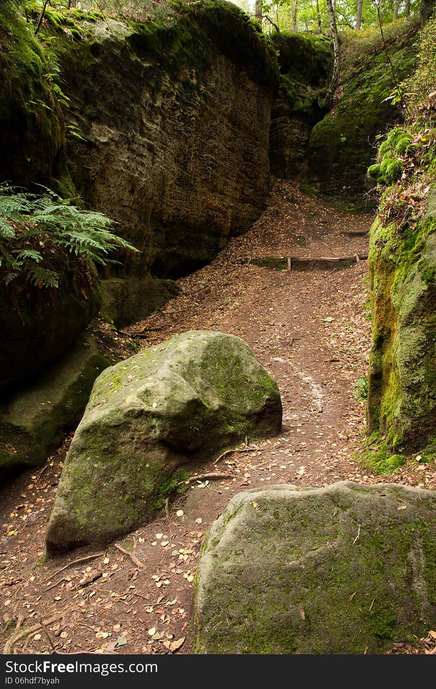 Gorge in the rocks, stones in the road