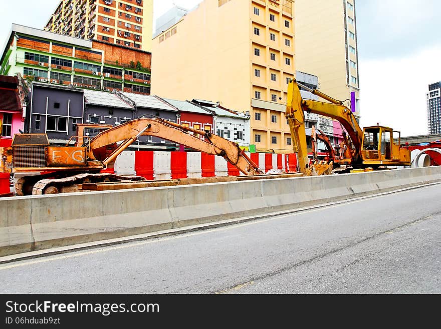 Excavators for road expansion traffic jam. Excavators for road expansion traffic jam