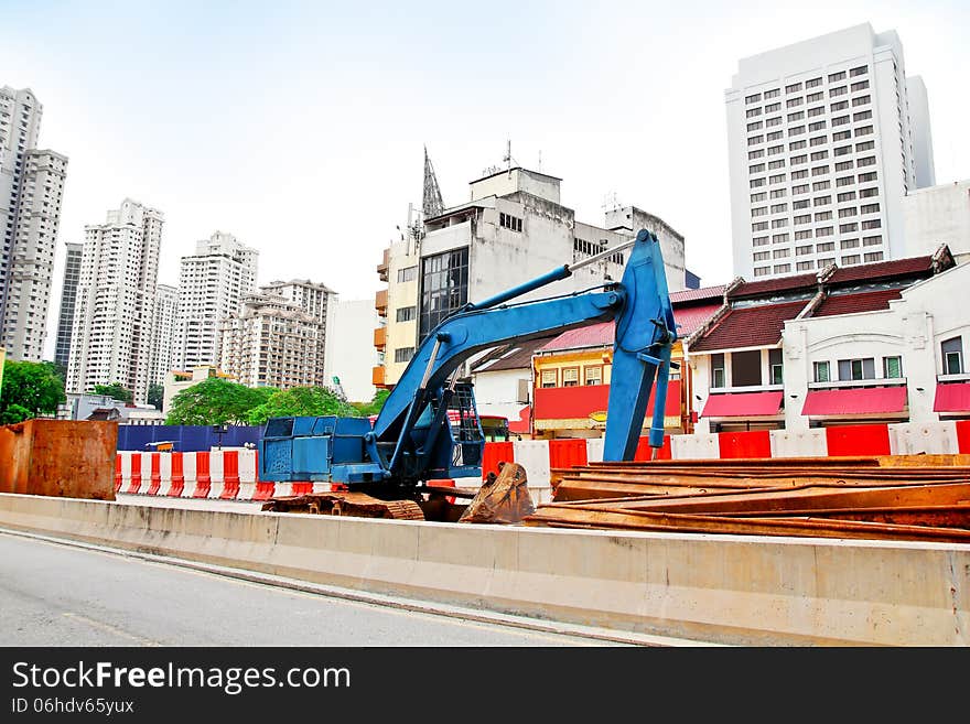 Excavators for road expansion traffic jam in the city. Excavators for road expansion traffic jam in the city