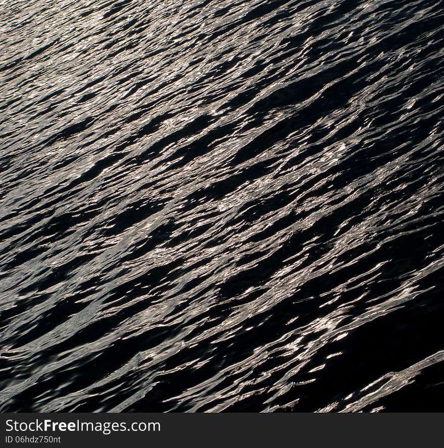 Reflection and glare on the waves in the river. Reflection and glare on the waves in the river