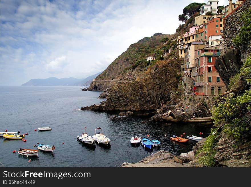 Cliff and colored houses of Riomaggiore in Italy. Cliff and colored houses of Riomaggiore in Italy