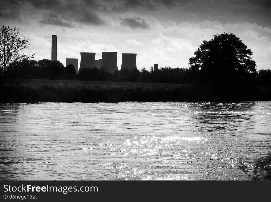 Black and white treatment of this moody power station overlooking rural scene. Black and white treatment of this moody power station overlooking rural scene