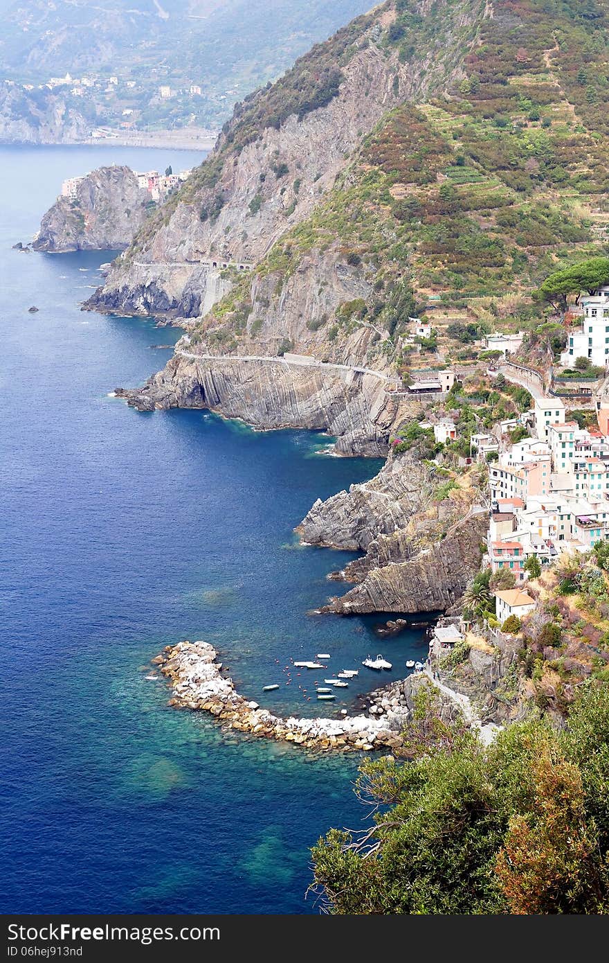 Cliff and colored houses of Riomaggiore in Italy. Cliff and colored houses of Riomaggiore in Italy