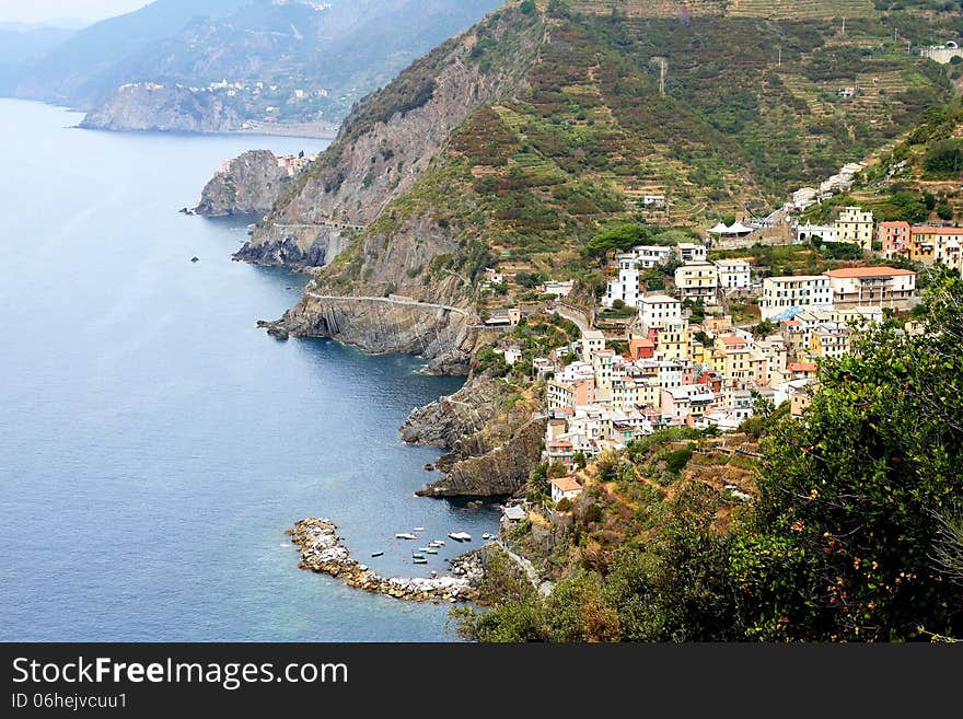 Cliff and colored houses of Riomaggiore in Italy. Cliff and colored houses of Riomaggiore in Italy