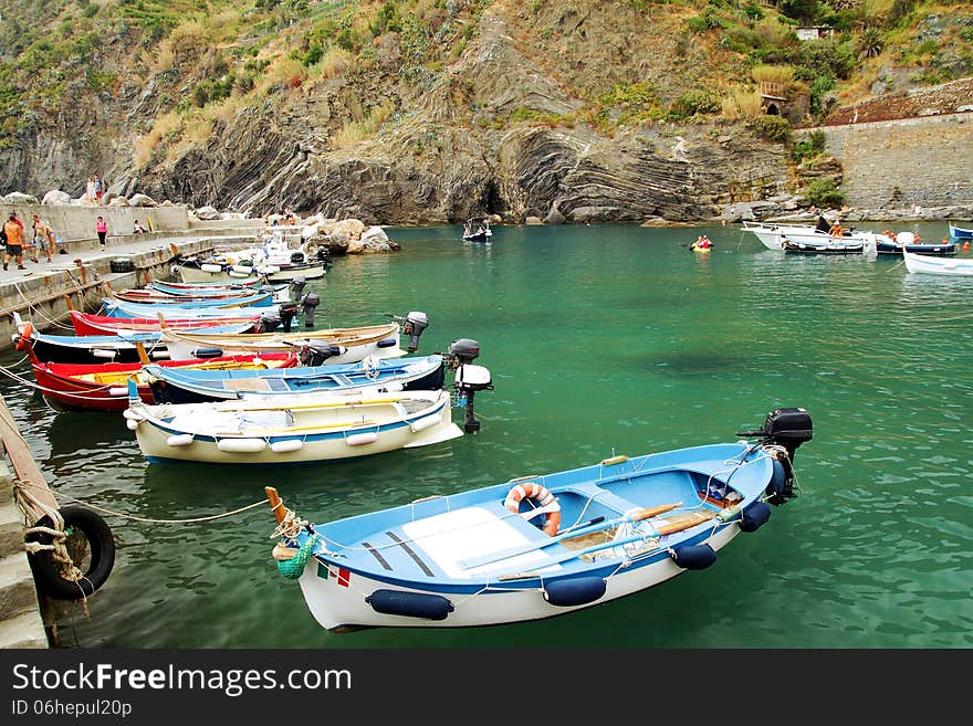 Coast and colored fishing boats of Vernazza in Italy. Coast and colored fishing boats of Vernazza in Italy