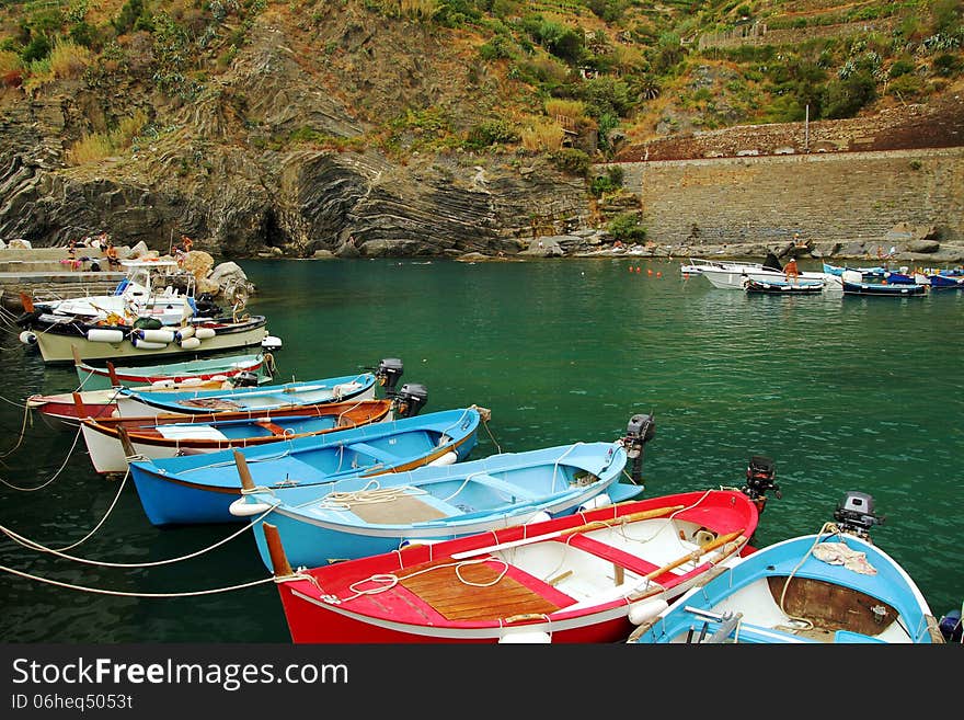 Coast and colored fishing boats of Vernazza in Italy. Coast and colored fishing boats of Vernazza in Italy