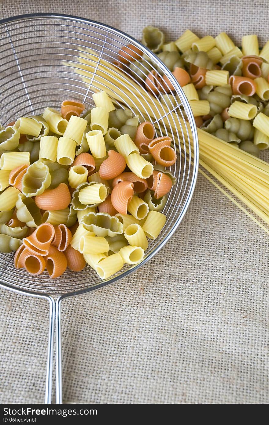 Uncooked pasta in colander